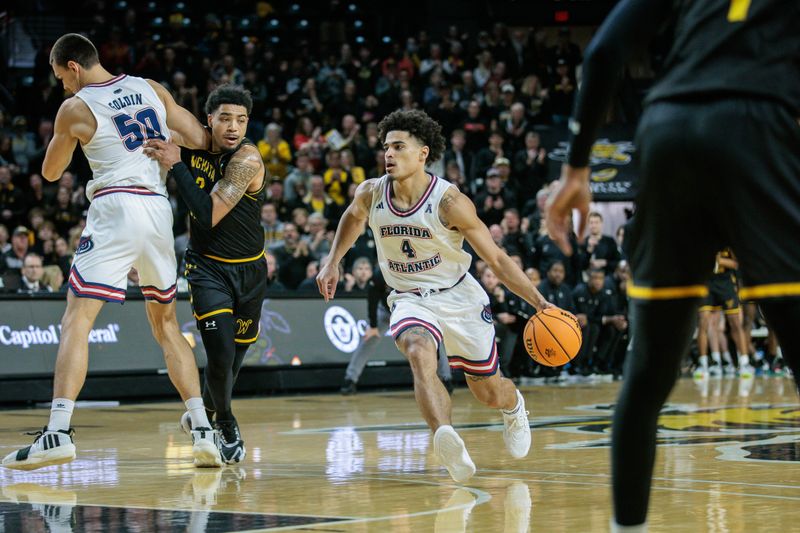 Feb 11, 2024; Wichita, Kansas, USA; Florida Atlantic Owls guard Bryan Greenlee (4) brings the ball up court during the second half against the Wichita State Shockers at Charles Koch Arena. Mandatory Credit: William Purnell-USA TODAY Sports