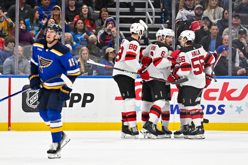 Nov 3, 2023; St. Louis, Missouri, USA;  New Jersey Devils center Curtis Lazar (42) is congratulated by teammates after scoring against the St. Louis Blues during the second period at Enterprise Center. Mandatory Credit: Jeff Curry-USA TODAY Sports