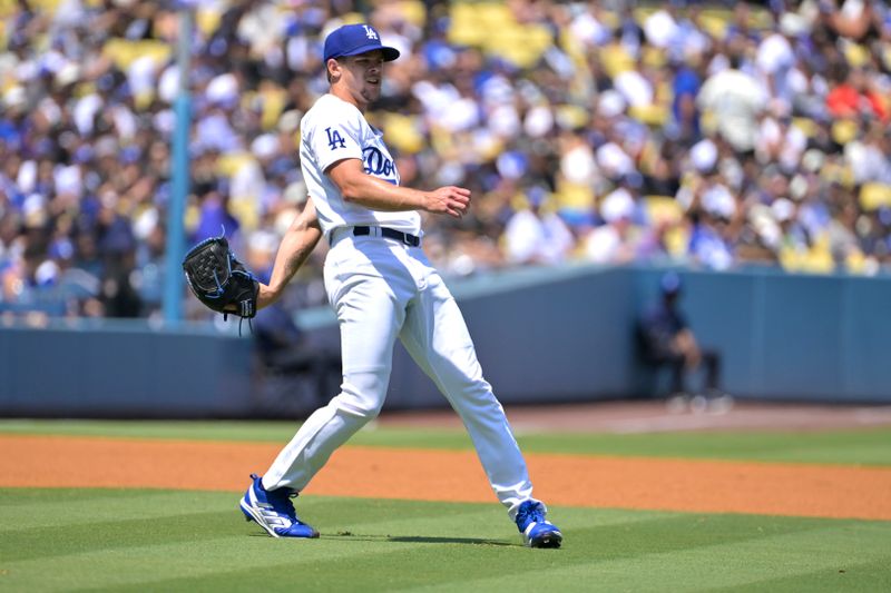 Aug 25, 2024; Los Angeles, California, USA;  Los Angeles Dodgers starting pitcher Gavin Stone (35) thors Tampa Bay Rays third baseman Junior Caminero (13) out at first in the first inning at Dodger Stadium. Mandatory Credit: Jayne Kamin-Oncea-USA TODAY Sports