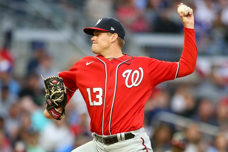 Apr 11, 2022; Atlanta, Georgia, USA; Washington Nationals starting pitcher Josh Rogers (13) throws a pitch against the Atlanta Braves in the first inning at Truist Park. Mandatory Credit: Brett Davis-USA TODAY Sports