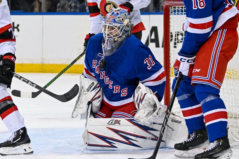 Jan 21, 2025; New York, New York, USA;  New York Rangers goaltender Igor Shesterkin (31) makes a save against the Ottawa Senators during the third period at Madison Square Garden. Mandatory Credit: Dennis Schneidler-Imagn Images