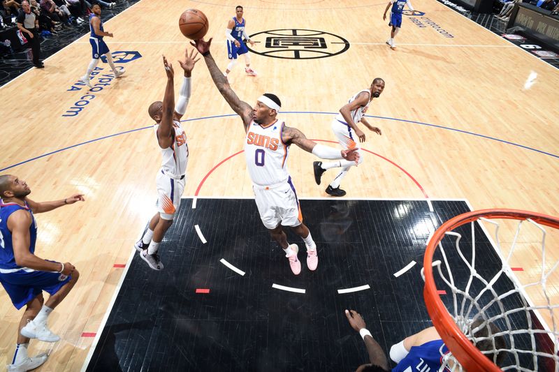 LOS ANGELES, CA - APRIL 20: Torrey Craig #0 of the Phoenix Suns rebounds the ball during the game against the LA Clippers during Round 1 Game 3 of the 2023 NBA Playoffs on April 20, 2023 at Crypto.Com Arena in Los Angeles, California. NOTE TO USER: User expressly acknowledges and agrees that, by downloading and/or using this Photograph, user is consenting to the terms and conditions of the Getty Images License Agreement. Mandatory Copyright Notice: Copyright 2023 NBAE (Photo by Andrew D. Bernstein/NBAE via Getty Images)