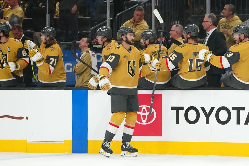 Apr 1, 2025; Las Vegas, Nevada, USA; Vegas Golden Knights center Nicolas Roy (10) celebrates after scoring a goal against the Edmonton Oilers during the first period at T-Mobile Arena. Mandatory Credit: Stephen R. Sylvanie-Imagn Images