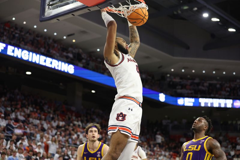 Jan 13, 2024; Auburn, Alabama, USA; Auburn Tigers forward Johni Broome (4) makes a dunk against the LSU Tigers during the second half at Neville Arena. Mandatory Credit: John Reed-USA TODAY Sports