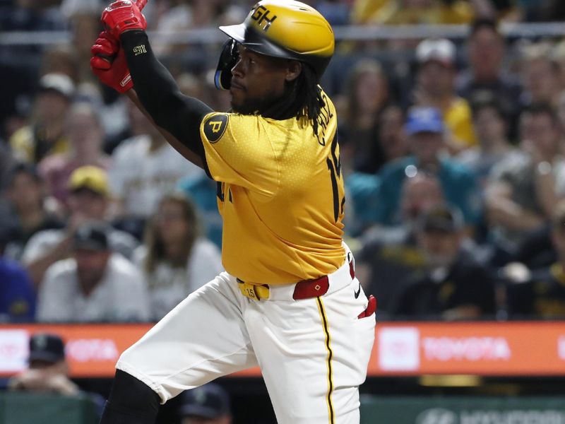 Aug 16, 2024; Pittsburgh, Pennsylvania, USA;  Pittsburgh Pirates shortstop Oneil Cruz (15) hits a two run double against the Seattle Mariners during the seventh inning at PNC Park. Mandatory Credit: Charles LeClaire-USA TODAY Sports