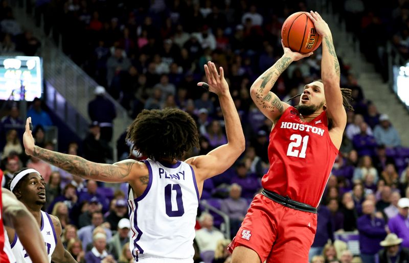 Jan 13, 2024; Fort Worth, Texas, USA; Houston Cougars guard Emanuel Sharp (21) shoots over TCU Horned Frogs guard Micah Peavy (0) during the second half at Ed and Rae Schollmaier Arena. Mandatory Credit: Kevin Jairaj-USA TODAY Sports