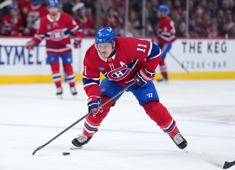Jan 22, 2026; Montreal, Quebec, CAN; Montreal Canadiens forward Brendan Gallagher (11) plays the puck during the first period against the Buffalo Sabres at the Bell Centre. Mandatory Credit: Eric Bolte-Imagn Images