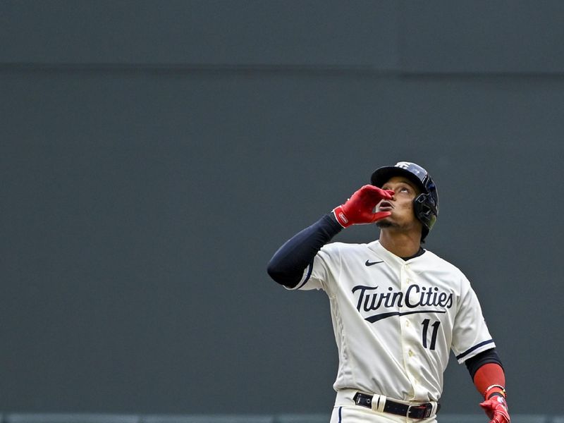 Apr 23, 2023; Minneapolis, Minnesota, USA;  Minnesota Twins infielder Jorge Polanco (11) celebrates an RBI single against the Washington Nationals during the fifth inning at Target Field. Mandatory Credit: Nick Wosika-USA TODAY Sports