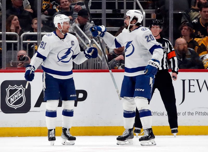 Apr 6, 2024; Pittsburgh, Pennsylvania, USA;  Tampa Bay Lightning center Steven Stamkos (91) celebrates his goal with left wing Nicholas Paul (20) against the Pittsburgh Penguins during the third period at PPG Paints Arena. The Penguins won 5-4. Mandatory Credit: Charles LeClaire-USA TODAY Sports