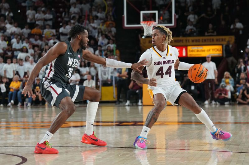 Feb 24, 2024; Tempe, Arizona, USA; Arizona State Sun Devils guard Adam Miller (44) dribbles against Washington State Cougars guard Kymany Houinsou (31) during the second half at Desert Financial Arena. Mandatory Credit: Joe Camporeale-USA TODAY Sports