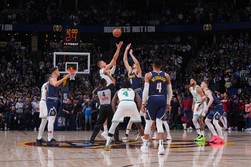 DENVER, CO - JANUARY 7:  Kristaps Porzingis #8 of the Boston Celtics and Dario Saric #9 of the Denver Nuggets go up for the opening tip off on January 7, 2025 at Ball Arena in Denver, Colorado. NOTE TO USER: User expressly acknowledges and agrees that, by downloading and/or using this Photograph, user is consenting to the terms and conditions of the Getty Images License Agreement. Mandatory Copyright Notice: Copyright 2025 NBAE (Photo by Bart Young/NBAE via Getty Images)