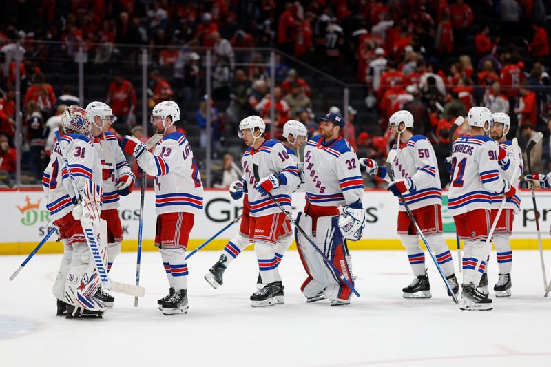 Apr 26, 2024; Washington, District of Columbia, USA; New York Rangers goaltender Igor Shesterkin (31) celebrates with teammates after their game against the Washington Capitals in game three of the first round of the 2024 Stanley Cup Playoffs at Capital One Arena. Mandatory Credit: Geoff Burke-USA TODAY Sports