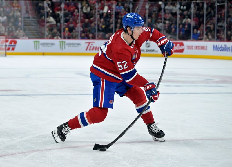 Nov 7, 2023; Montreal, Quebec, CAN; Montreal Canadiens defenseman Justin Barron (52) shoots the puck during the third period of the game against the Tampa Bay Lightning at the Bell Centre. Mandatory Credit: Eric Bolte-USA TODAY Sports