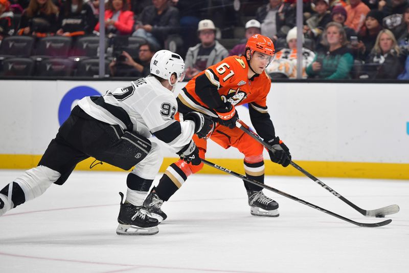 Nov 29, 2024; Anaheim, California, USA; Anaheim Ducks left wing Cutter Gauthier (61) moves in for a shot against Los Angeles Kings defenseman Brandt Clarke (92) during the second period at Honda Center. Mandatory Credit: Gary A. Vasquez-Imagn Images