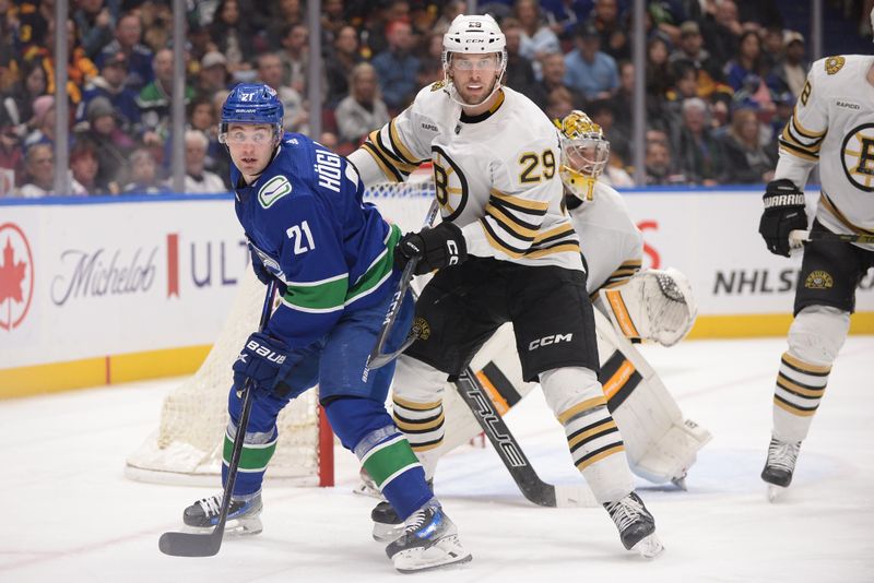 Feb 24, 2024; Vancouver, British Columbia, CAN;  Boston Bruins defenseman Parker Wotherspoon (29) defends against Vancouver Canucks forward Nils Hoglander (21) during the third period at Rogers Arena. Mandatory Credit: Anne-Marie Sorvin-USA TODAY Sports