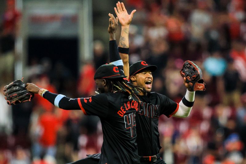 Jul 12, 2024; Cincinnati, Ohio, USA; Cincinnati Reds outfielder Will Benson (30) high fives shortstop Elly De La Cruz (44) after the victory over the Miami Marlins at Great American Ball Park. Mandatory Credit: Katie Stratman-USA TODAY Sports