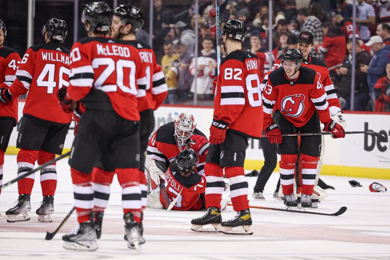 Jan 22, 2024; Newark, New Jersey, USA; New Jersey Devils right wing Tyler Toffoli (73) is tackled by goaltender Vitek Vanecek (41) after scoring his game-winning goal in overtime against the Vegas Golden Knights at Prudential Center. Mandatory Credit: Vincent Carchietta-USA TODAY Sports