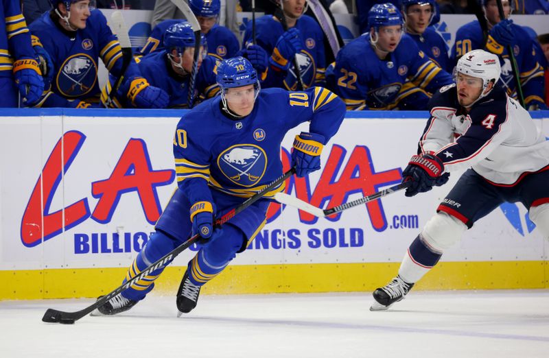 Dec 30, 2023; Buffalo, New York, USA;  Buffalo Sabres defenseman Henri Jokiharju (10) looks to make a pass as Columbus Blue Jackets center Cole Sillinger (4) defends during the first period at KeyBank Center. Mandatory Credit: Timothy T. Ludwig-USA TODAY Sports