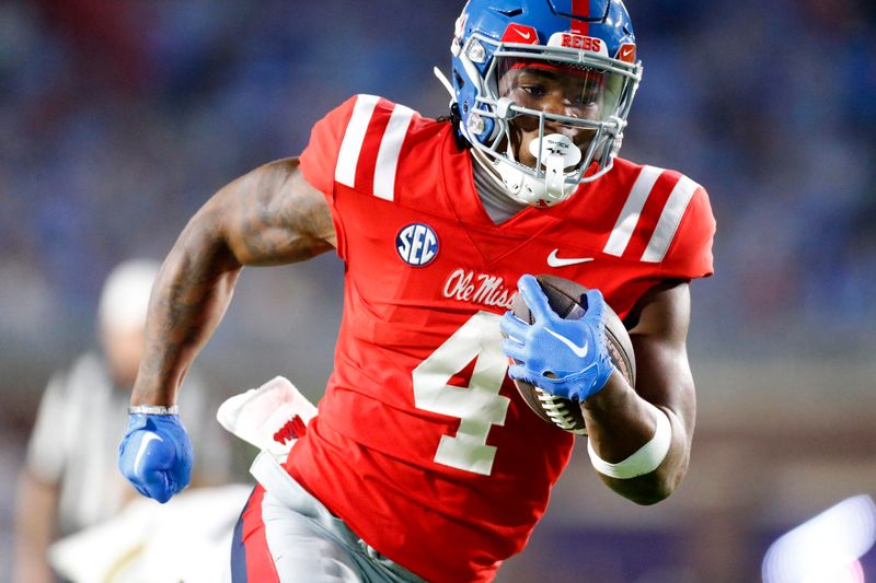 Oct 28, 2023; Oxford, Mississippi, USA; Mississippi Rebels running back Quinshon Judkins (4) runs the ball for a touchdown during the first half against the Vanderbilt Commodores at Vaught-Hemingway Stadium. Mandatory Credit: Petre Thomas-USA TODAY Sports