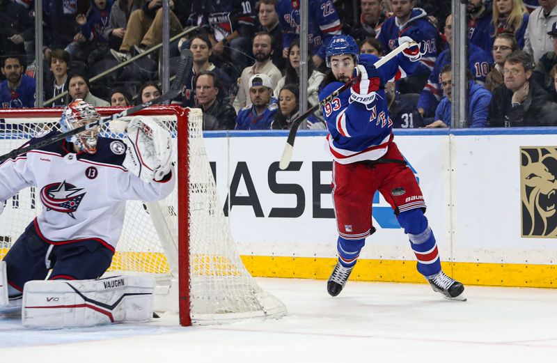 Jan 18, 2025; New York, New York, USA; New York Rangers center Mika Zibanejad (93) attempts a wrap-around Michigan-style shot on Columbus Blue Jackets goalie Daniil Tarasov (40) during the third period at Madison Square Garden. Mandatory Credit: Danny Wild-Imagn Images