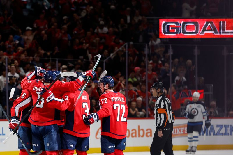 Nov 26, 2025; Washington, District of Columbia, USA; Washington Capitals left wing Alex Ovechkin (8) celebrates with teammates after scoring a goal against the Winnipeg Jets during the second period at Capital One Arena. Mandatory Credit: Geoff Burke-Imagn Images