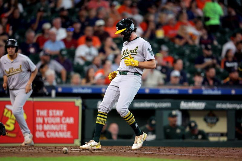 Sep 12, 2024; Houston, Texas, USA; Oakland Athletics shortstop Jacob Wilson (5) crosses home plate to score a run against the Houston Astros during the seventh inning at Minute Maid Park. Mandatory Credit: Erik Williams-Imagn Images