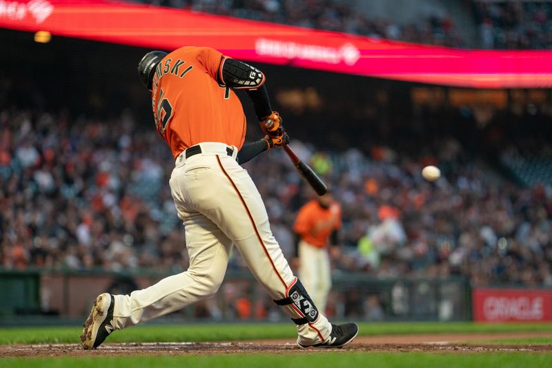 Jun 2, 2023; San Francisco, California, USA;  San Francisco Giants right fielder Mike Yastrzemski (5) hits a RBI double against the Baltimore Orioles during the third inning at Oracle Park. Mandatory Credit: Neville E. Guard-USA TODAY Sports