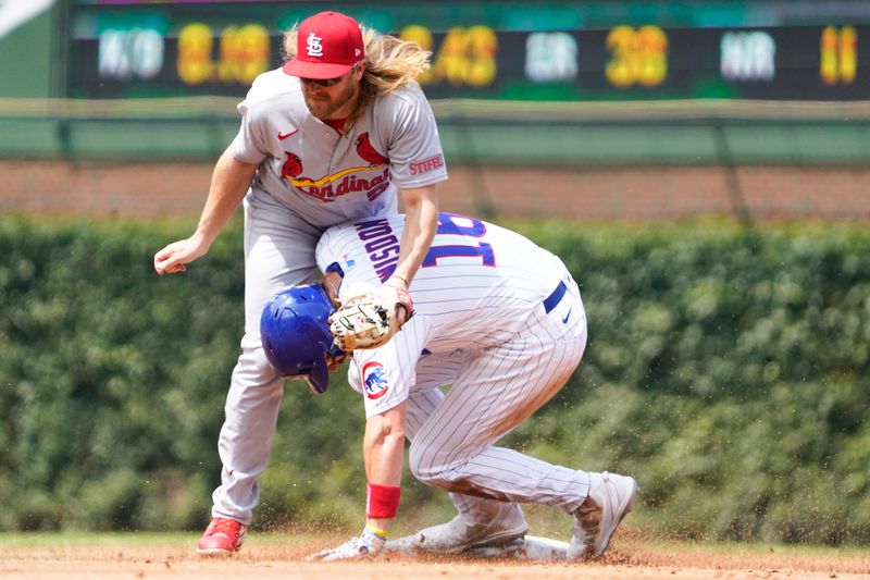 Jul 23, 2023; Chicago, Illinois, USA; Chicago Cubs third baseman Patrick Wisdom (16) steals second base as St. Louis Cardinals second baseman Tyler Motter (55) makes a late tag during the third inning at Wrigley Field. Mandatory Credit: David Banks-USA TODAY Sports