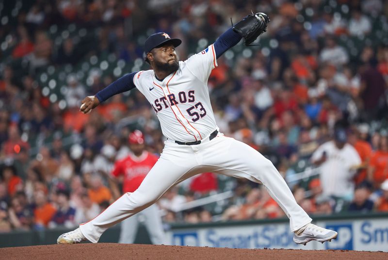 May 21, 2024; Houston, Texas, USA; Houston Astros starting pitcher Cristian Javier (53) delivers a pitch during the second inning against the Los Angeles Angels at Minute Maid Park. Mandatory Credit: Troy Taormina-USA TODAY Sports