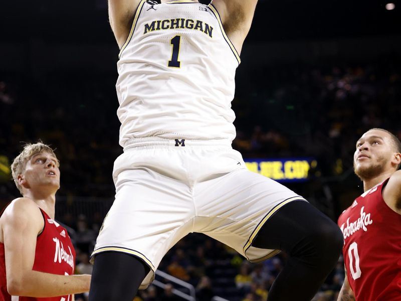 Feb 8, 2023; Ann Arbor, Michigan, USA;  Michigan Wolverines center Hunter Dickinson (1) dunks in the first half against the Nebraska Cornhuskers at Crisler Center. Mandatory Credit: Rick Osentoski-USA TODAY Sports