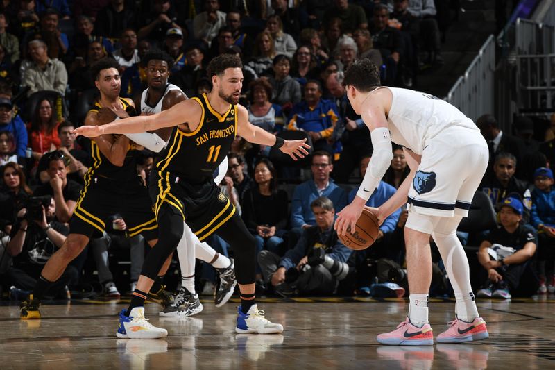 SAN FRANCISCO, CA - MARCH 20: Klay Thompson #11 of the Golden State Warriors plays defense against the Memphis Grizzlies on March 20, 2024 at Chase Center in San Francisco, California. NOTE TO USER: User expressly acknowledges and agrees that, by downloading and or using this photograph, user is consenting to the terms and conditions of Getty Images License Agreement. Mandatory Copyright Notice: Copyright 2024 NBAE (Photo by Noah Graham/NBAE via Getty Images)