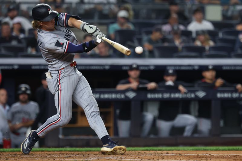 Aug 13, 2025; Bronx, New York, USA; Minnesota Twins second baseman Luke Keaschall (15) singles during the sixth inning against the New York Yankees at Yankee Stadium. Mandatory Credit: Vincent Carchietta-Imagn Images
