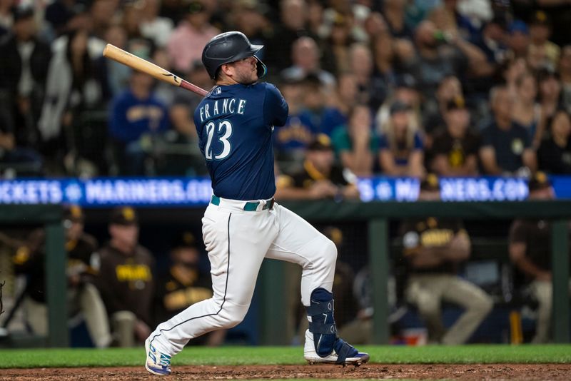 Aug 9, 2023; Seattle, Washington, USA; Seattle Mariners first baseman Ty France (23) hits an RBI double during the eighth inning against the San Diego Padres at T-Mobile Park. Mandatory Credit: Stephen Brashear-USA TODAY Sports