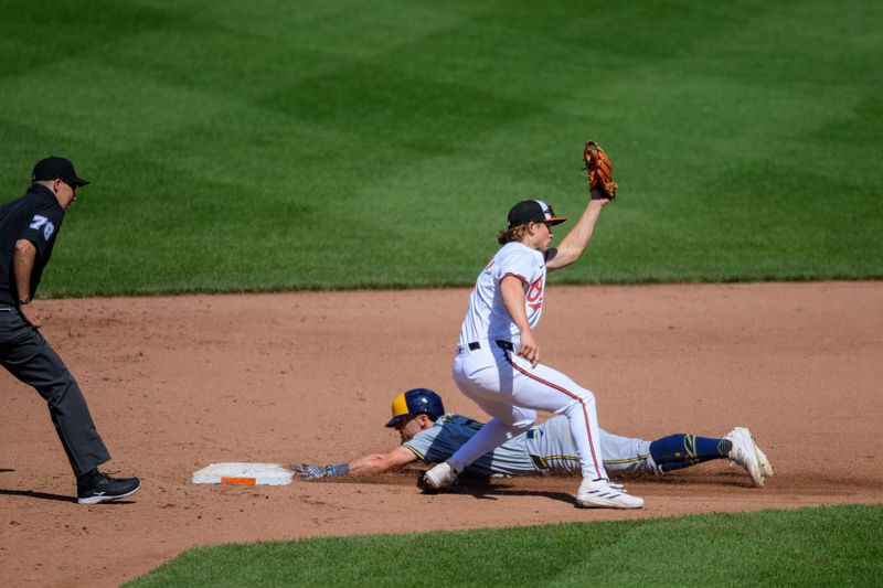 Apr 14, 2024; Baltimore, Maryland, USA; Milwaukee Brewers outfielder Sal Frelick (10) slides safely into second base under the tag of Baltimore Orioles second base Jackson Holliday (7) during the fifth inning at Oriole Park at Camden Yards. Mandatory Credit: Reggie Hildred-USA TODAY Sports