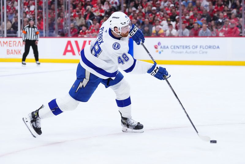 Apr 28, 2025; Sunrise, Florida, USA; Tampa Bay Lightning defenseman Nick Perbix (48) shoots the puck against the Florida Panthers during the second period in game four of the first round of the 2025 Stanley Cup Playoffs at Amerant Bank Arena. Mandatory Credit: Rich Storry-Imagn Images