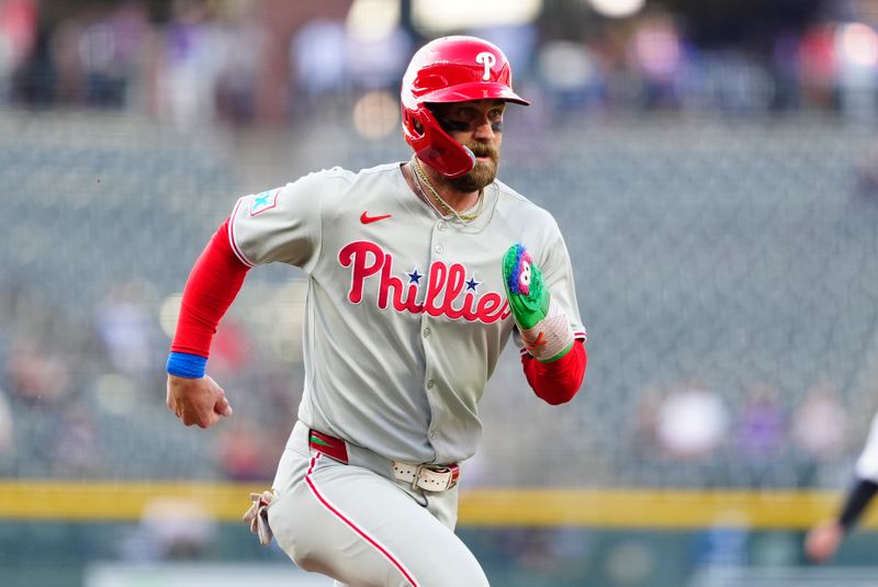 May 21, 2025; Denver, Colorado, USA; Philadelphia Phillies first base Bryce Harper (3) scores in the first inning against the Colorado Rockies at Coors Field. Mandatory Credit: Ron Chenoy-Imagn Images