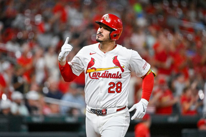 Sep 11, 2024; St. Louis, Missouri, USA;  St. Louis Cardinals third baseman Nolan Arenado (28) reacts after hitting a solo home run against the Cincinnati Reds during the fourth inning at Busch Stadium. Mandatory Credit: Jeff Curry-Imagn Images