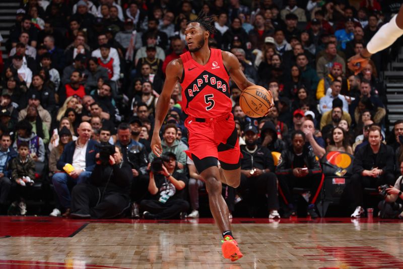 TORONTO, CANADA - FEBRUARY 28: Immanuel Quickley #5 of the Toronto Raptors dribbles the ball during the game against the Dallas Mavericks on February 28, 2024 at the Scotiabank Arena in Toronto, Ontario, Canada.  NOTE TO USER: User expressly acknowledges and agrees that, by downloading and or using this Photograph, user is consenting to the terms and conditions of the Getty Images License Agreement.  Mandatory Copyright Notice: Copyright 2024 NBAE (Photo by Vaughn Ridley/NBAE via Getty Images)