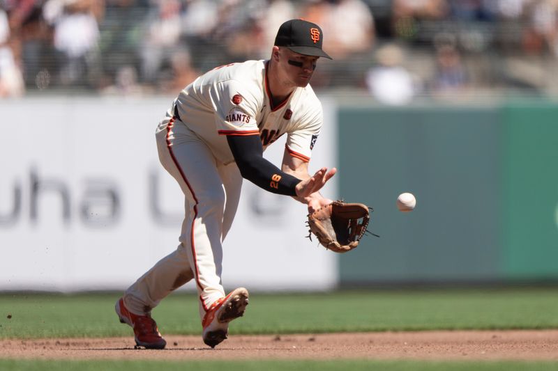 Sep 5, 2024; San Francisco, California, USA;  San Francisco Giants third base Matt Chapman (26) catches the ball during the fourth inning against the Arizona Diamondbacks at Oracle Park. Mandatory Credit: Stan Szeto-Imagn Images