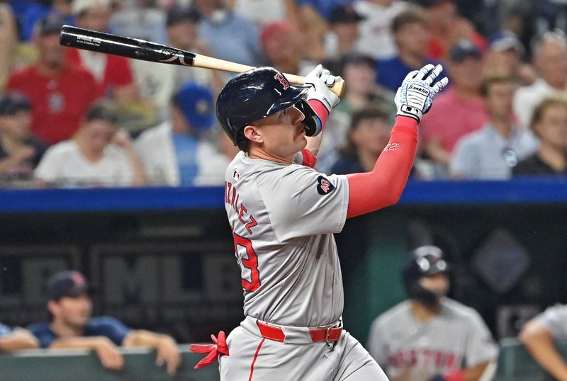 Aug 5, 2024; Kansas City, Missouri, USA;  Boston Red Sox pinch hitter Romy Gonzalez (23) hits a two run home run in the seventh inning against the Kansas City Royals at Kauffman Stadium. Mandatory Credit: Peter Aiken-USA TODAY Sports