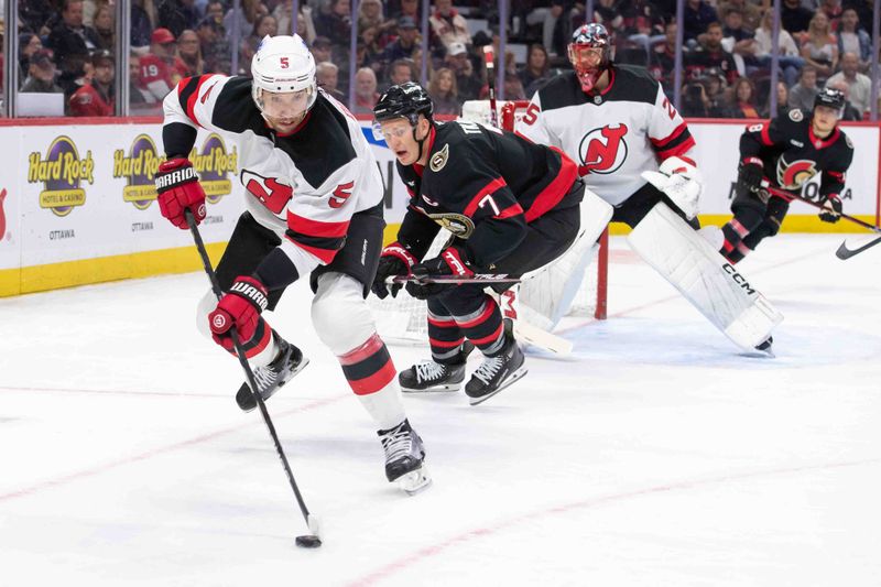 Oct 17, 2024; Ottawa, Ontario, CAN; New Jersey Devils defenseman Brendan Dillon (5) skates with the puck in front of Ottawa Senators left wing Brady Tkachuk (7) in the first period at the Canadian Tire Centre. Mandatory Credit: Marc DesRosiers-Imagn Images