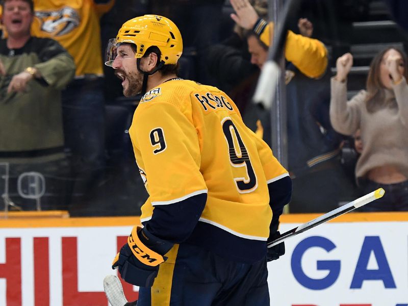 Nov 11, 2023; Nashville, Tennessee, USA; Nashville Predators left wing Filip Forsberg (9) celebrates after scoring to tie the game during the third period against the Arizona Coyotes at Bridgestone Arena. Mandatory Credit: Christopher Hanewinckel-USA TODAY Sports