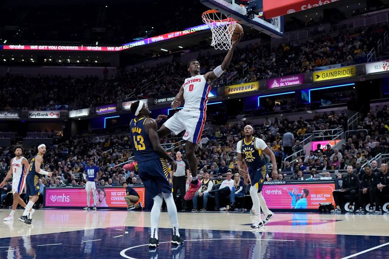 INDIANAPOLIS, INDIANA - FEBRUARY 22: Jalen Duren #0 of the Detroit Pistons attempts a layup while being guarded by Pascal Siakam #43 of the Indiana Pacers in the third quarter at Gainbridge Fieldhouse on February 22, 2024 in Indianapolis, Indiana. NOTE TO USER: User expressly acknowledges and agrees that, by downloading and or using this photograph, User is consenting to the terms and conditions of the Getty Images License Agreement. (Photo by Dylan Buell/Getty Images)