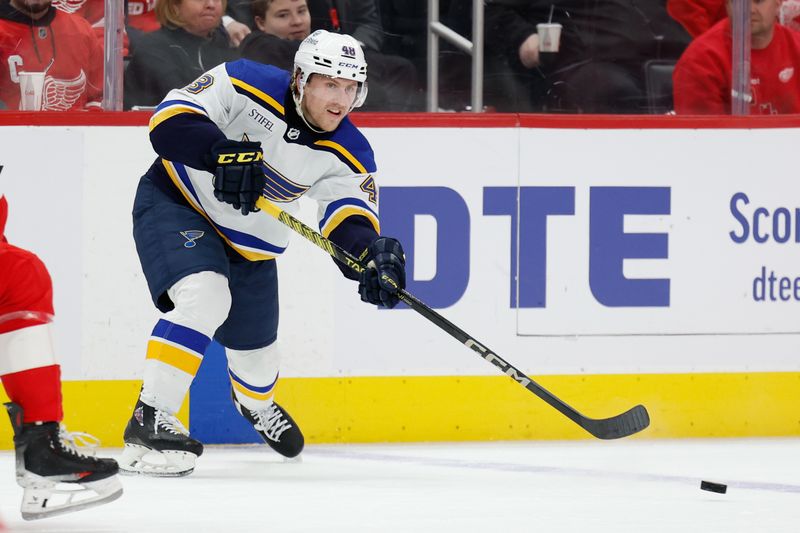 Feb 24, 2024; Detroit, Michigan, USA;  St. Louis Blues defenseman Scott Perunovich (48) passes in the third period against the Detroit Red Wings at Little Caesars Arena. Mandatory Credit: Rick Osentoski-USA TODAY Sports