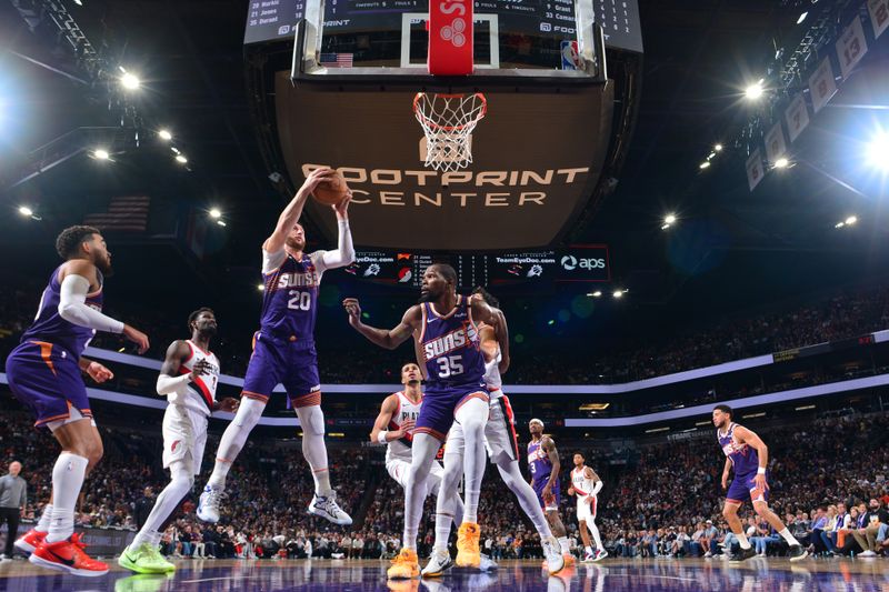 PHOENIX, AZ - NOVEMBER 2: Jusuf Nurkic #20 of the Phoenix Suns grabs the rebound during the game against the Portland Trail Blazers on November 2, 2024 at Footprint Center in Phoenix, Arizona. NOTE TO USER: User expressly acknowledges and agrees that, by downloading and or using this photograph, user is consenting to the terms and conditions of the Getty Images License Agreement. Mandatory Copyright Notice: Copyright 2024 NBAE (Photo by Kate Frese/NBAE via Getty Images)