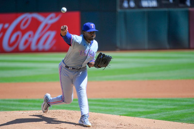 Sep 26, 2024; Oakland, California, USA; Texas Rangers pitcher Kumar Rocker (80) throws a pitch during the first inning against the Oakland Athletics at Oakland-Alameda County Coliseum. Mandatory Credit: Ed Szczepanski-Imagn Images