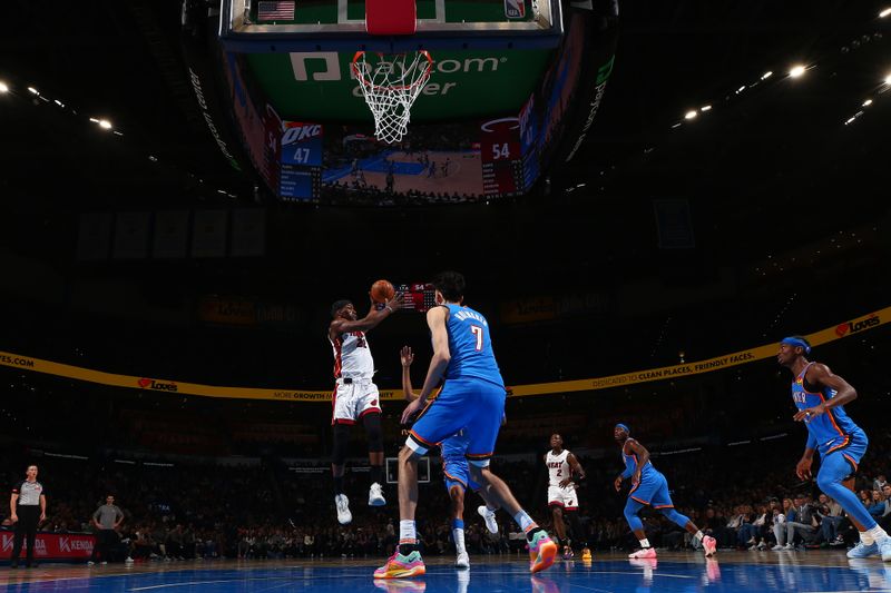 OKLAHOMA CITY, OK - MARCH 8:  Jimmy Butler #22 of the Miami Heat grabs a rebound during the game against the Oklahoma City Thunder on March 8, 2024 at Paycom Arena in Oklahoma City, Oklahoma. NOTE TO USER: User expressly acknowledges and agrees that, by downloading and or using this photograph, User is consenting to the terms and conditions of the Getty Images License Agreement. Mandatory Copyright Notice: Copyright 2024 NBAE (Photo by Zach Beeker/NBAE via Getty Images)