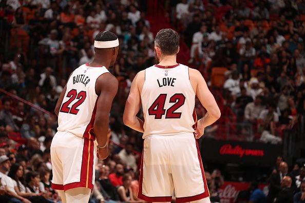 MIAMI, FL - DECEMBER 2: Jimmy Butler #22 of the Miami Heat talks with Kevin Love #42 during the game against the Indiana Pacers on December 2, 2023 at Kaseya Center in Miami, Florida. NOTE TO USER: User expressly acknowledges and agrees that, by downloading and or using this Photograph, user is consenting to the terms and conditions of the Getty Images License Agreement. Mandatory Copyright Notice: Copyright 2023 NBAE (Photo by Issac Baldizon/NBAE via Getty Images)