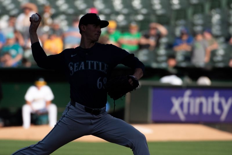 Jun 4, 2024; Oakland, California, USA; Seattle Mariners pitcher George Kirby (68) throws a pitch during the first inning against the Oakland Athletics at Oakland-Alameda County Coliseum. Mandatory Credit: Ed Szczepanski-USA TODAY Sports