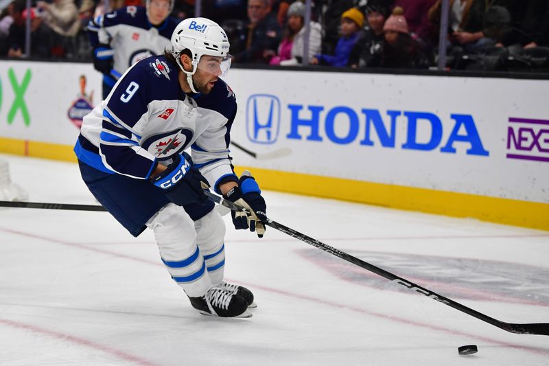 Jan 5, 2024; Anaheim, California, USA; Winnipeg Jets left wing Alex Iafallo (9) controls the puck against the Anaheim Ducks during the first period at Honda Center. Mandatory Credit: Gary A. Vasquez-USA TODAY Sports